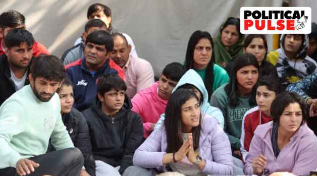 Wrestlers sit in protest at Delhi's Jantar Mantar on Friday. (Express Photo: Praveen Khanna)