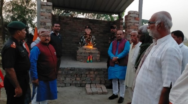 Army personnel with locals at the memorial on Monday. (Express photo)