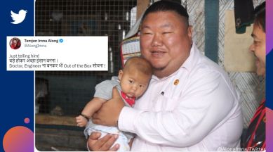 BJP leader and Nagaland minister Temjen Imna Along poses with baby