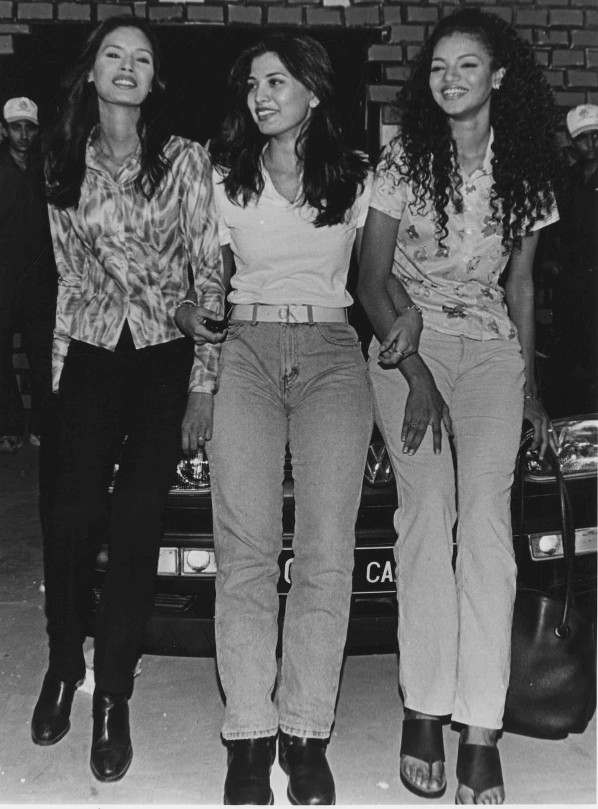 Fashion designer Ritu Beri, center, holding two models on her left is Noyonika Chatterjee *** Local Caption *** Fashion designer Ritu Beri, center, holding two models on her left is Nayanika Chatterjee. Express Photo by Hemant Chawla