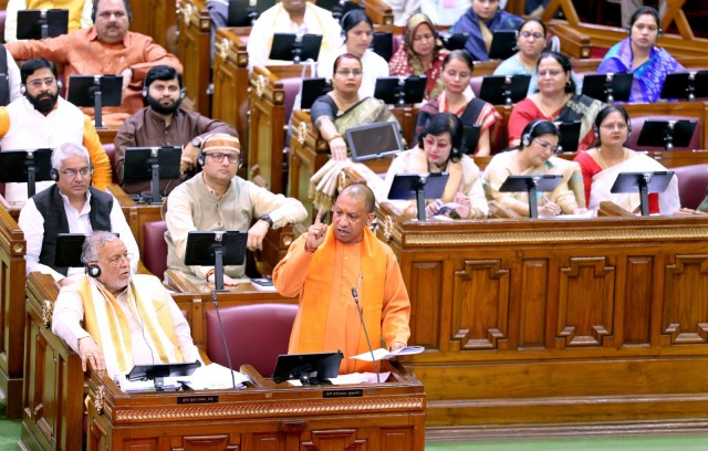 CM Yogi Adityanath with state Finance Minister Suresh Khanna at the Assembly in Lucknow on Saturday. (Express Photo)
