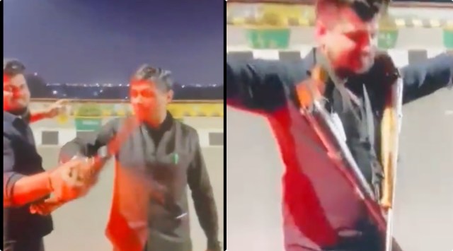 In the purported video, at least five men can be seen dancing and waving the gun. A person can be seen dancing, wearing a garland of two guns. 
(Twitter/@rishabhmanitrip)