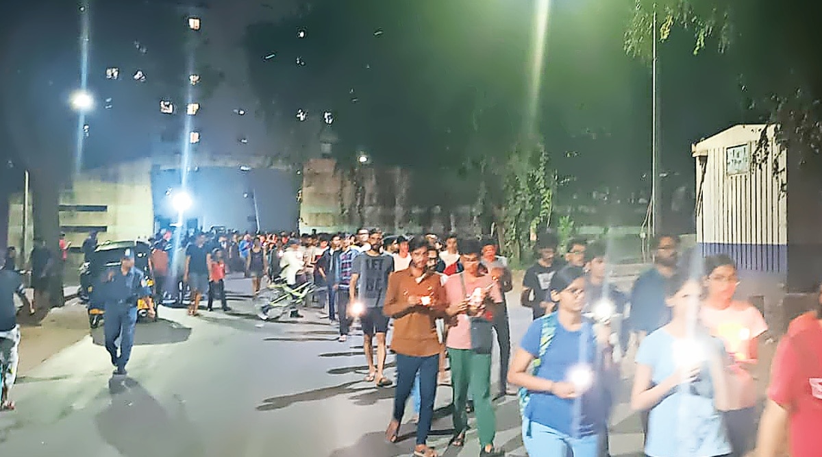 Students gather for a candlelight march late Sunday night.