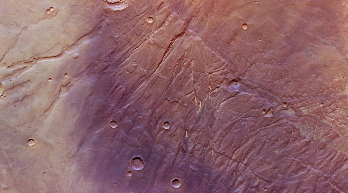 The near-vertical scars at the centre of the image of Mars are deep surface fractures that are known as Nectaris Fossae. (Image credit: ESA/DLR/FU Berlin)