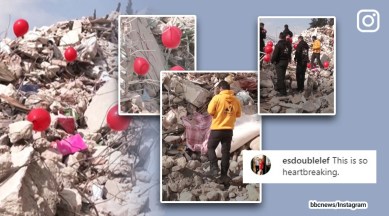 Red ballons being stuck over rubble