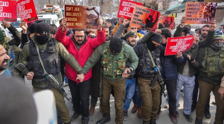 Security personnel stop PDP workers during a protest over J&K anti-encroachment drive in Srinagar on Tuesday. (PTI)