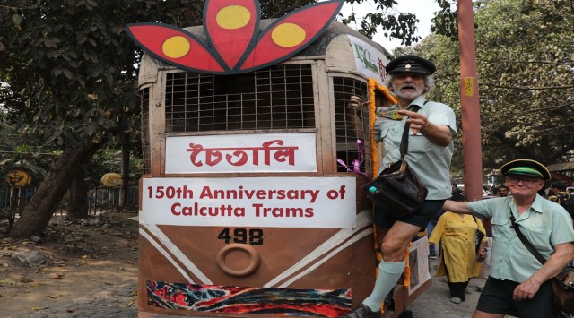 A tram decorated as part of the 150th anniversary celebrations; (right), Roberto D Andera, a former tram Conductor from Melbourne in Australia, poses for photos aboard a tram with his friend Tony Graham, in Kolkata on Friday. (Express Photos: by Partha Paul)