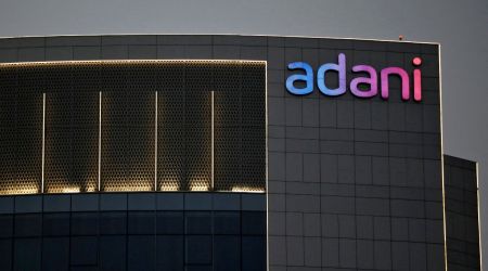 The logo of the Adani group is seen on the facade of one of its buildings on the outskirts of Ahmedabad. (Reuters)