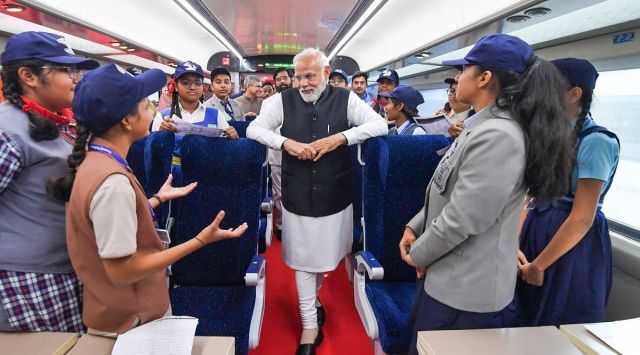 Prime Minister Narendra Modi interacts with school students during the flagging of ceremony of two Vande Bharat Express trains, in Mumbai. (PTI)
