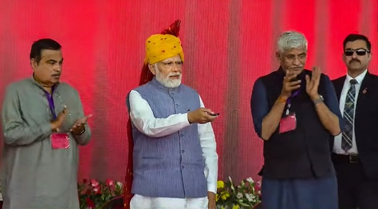 Prime Minister Narendra Modi with Union Minister for Road Transport & Highways Nitin Gadkari and Union Minister for Jal Shakti Gajendra Singh Shekhawat during the inauguration of a section of Delhi-Mumbai Expressway and various other projects, in Dausa, Sunday, Feb. 12, 2023. (PTI Photo)