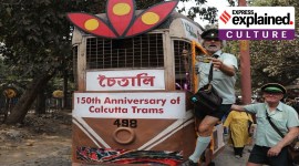 Roberto D Andera, a former tram Conductor from Melbourne in Australia, poses for photos aboard a tram with his friend Tony Graham, in Kolkata on Friday.
