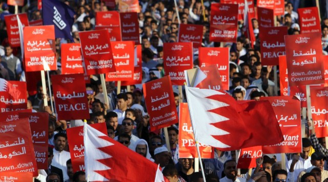 Tens of thousands of Bahraini anti-government protesters participate in a rally Friday, Nov. 25, 2011, in Maqsha, Bahrain. Hackers said they had taken down the website of Bahrain's international airport on Tuesday, Feb. 14, 2023, to mark the 12-year anniversary of an Arab Spring uprising in the small Gulf country. (AP Photo/Hasan Jamali, File)