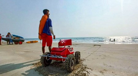 A lifeguard with an artificial intelligence-based robot 'Aurus' after it was introduced to save lives on beaches and other water bodies in Goa by a state-appointed lifeguard services agency. (PTI Photo)