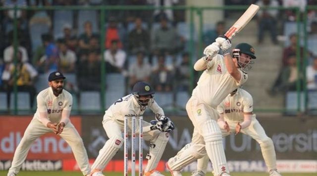 Australia's Travis Head, right, plays a shot during the second day of the second cricket test match between India and Australia in New Delhi, India, Saturday, Feb. 18, 2023. (AP Photo/Altaf Qadri)