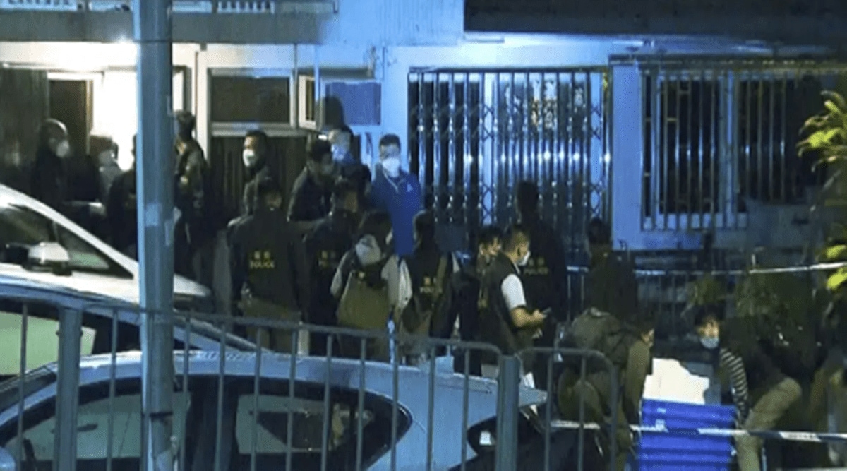 In this image taken from video footage provided by TVB Hong Kong, police officers search a village home where they found body parts related to a missing model in a murder case, in Hong Kong on Sunday, Feb. 26. (AP)
