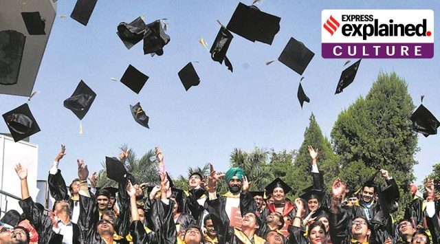 Graduating students throwing their caps in the air.