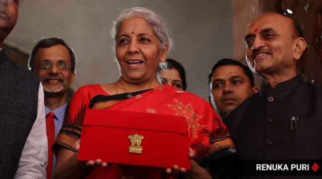 Union Finance Minister Nirmala Sitharaman shows a folder-case containing her Union Budget 2023-24 speech as she arrives at the Parliament, in New Delhi, Wednesday, Feb. 1, 2023.
