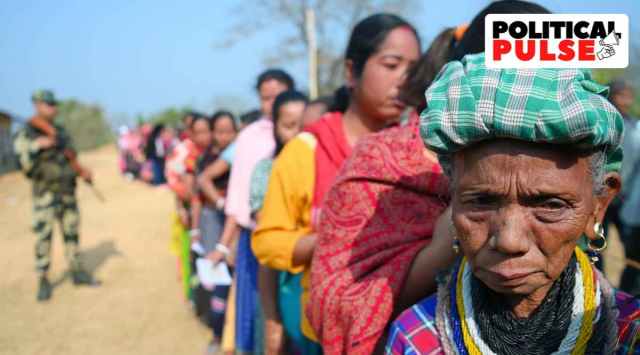 A lady from Reang Community waits in queues to cast their votes during the Tripura Assembly elections in Hazara Para, some 80 km away from Agartala. (Express Photo: Abhishek Saha)