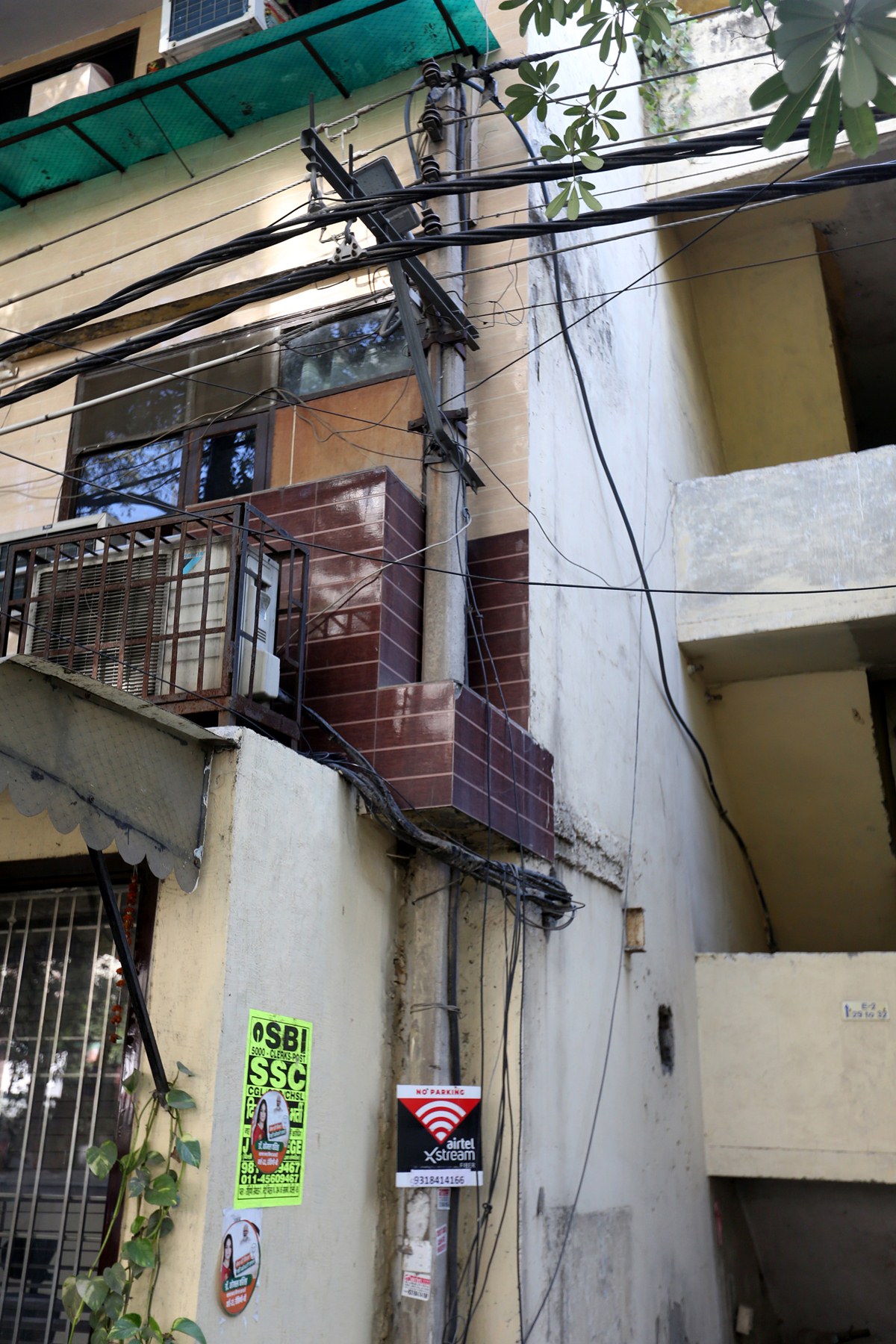Through roofs, in drawing rooms: Delhi electric poles lose out to encroachment | Cities News,The ...