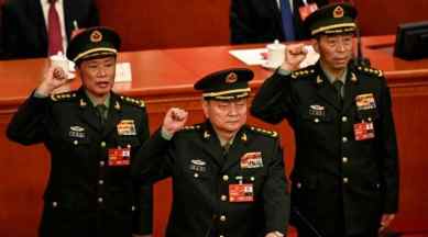 Zhang Youxia (C), newly-elected Vice Chairman of the Central Military Commission of the People's Republic of China, swears an oath with Central Military Commission members He Weidong and Li Shangfu after they were elected during the fourth plenary session of the National People's Congress (NPC) at the Great Hall of the People in Beijing on March 11, 2023. (REUTERS/File Photo)