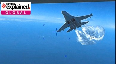 A Russian Su-27 military aircraft dumps fuel while flying towards a U.S. Air Force intelligence, surveillance, and reconnaissance unmanned MQ-9 aircraft, also known as the "Reaper" drone.