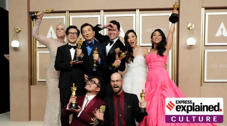 Jamie Lee Curtis, from back left, Ke Huy Quan, James Hong, Jonathan Wang, Michelle Yeoh, and Stephanie Hsu, Daniel Kwan, left front, and Daniel Scheinert, winners of the award for best film for "Everything Everywhere All at Once," pose in the press room at the Oscars on Sunday, March 12, 2023, at the Dolby Theatre in Los Angeles.