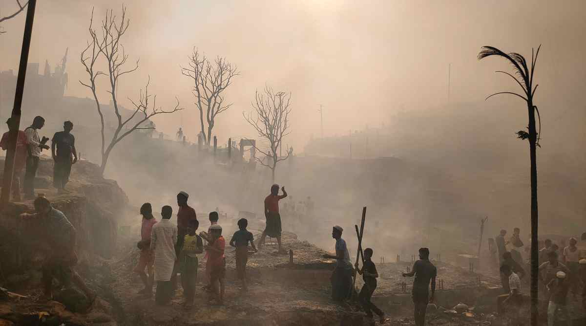 Rohingya refugees try to salvage their belongings after a major fire in their Balukhali camp at Ukhiya in Cox's Bazar district, Bangladesh, Sunday, March 5, 2023. (AP/PTI)