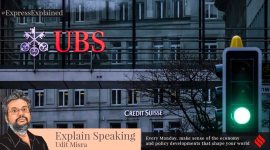 A traffic light signals green in front of the logos of the Swiss banks Credit Suisse and UBS in Zurich, Switzerland, Sunday March 19, 2023.