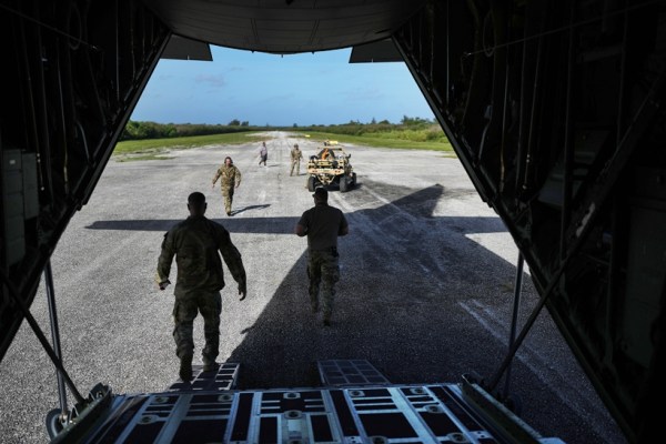 American airmen unload equipment on one of World War II-era runways on the Pacific isle of Tinian, Northern Mariana Islands, on Feb. 17, 2023. Rattled by China’s military buildup and territorial threats — along with Russia’s war of aggression in Ukraine and doubts about U.S. resolve — nations across the region are bolstering defense budgets, joint training, weapons manufacturing and combat-ready infrastructure. (Chang W. Lee/The New York Times)