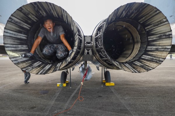 A Japanese mechanic checks the jets between flights at the Tinian airport, on Feb. 17, 2023. Rattled by ChinaÕs military buildup and territorial threats Ñ along with RussiaÕs war of aggression in Ukraine and doubts about U.S. resolve Ñ nations across the region are bolstering defense budgets, joint training, weapons manufacturing and combat-ready infrastructure. (Chang W. Lee/The New York Times)