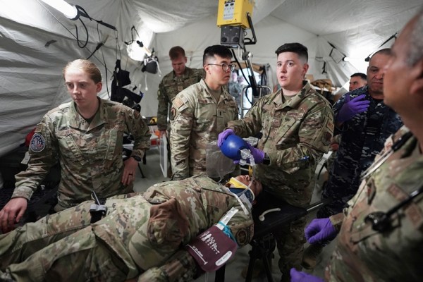 American, Australian and Japanese military medical teams during a drill at Andersen Air Force Base, on Feb. 17, 2023. Rattled by China’s military buildup and territorial threats — along with Russia’s war of aggression in Ukraine and doubts about U.S. resolve — nations across the region are bolstering defense budgets, joint training, weapons manufacturing and combat-ready infrastructure. (Chang W. Lee/The New York Times)