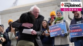 U.S. Senator Bernie Sanders (I-VT) hugs a supporter of student loan debt relief in front of the Supreme Court