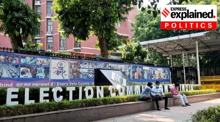 Men sitting outside the Election Commission of India office in New Delhi. (Express Photo by Praveen Khanna)