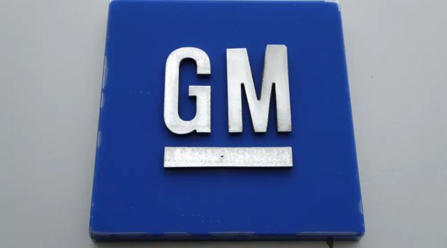 The General Motors logo is displayed outside the General Motors Detroit-Hamtramck Assembly plant. (AP) 