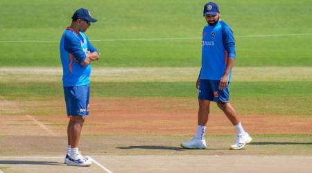Indian cricket team head coach Rahul Dravid and captain Rohit Sharma inspect the pitch during a practice session. (FILE)