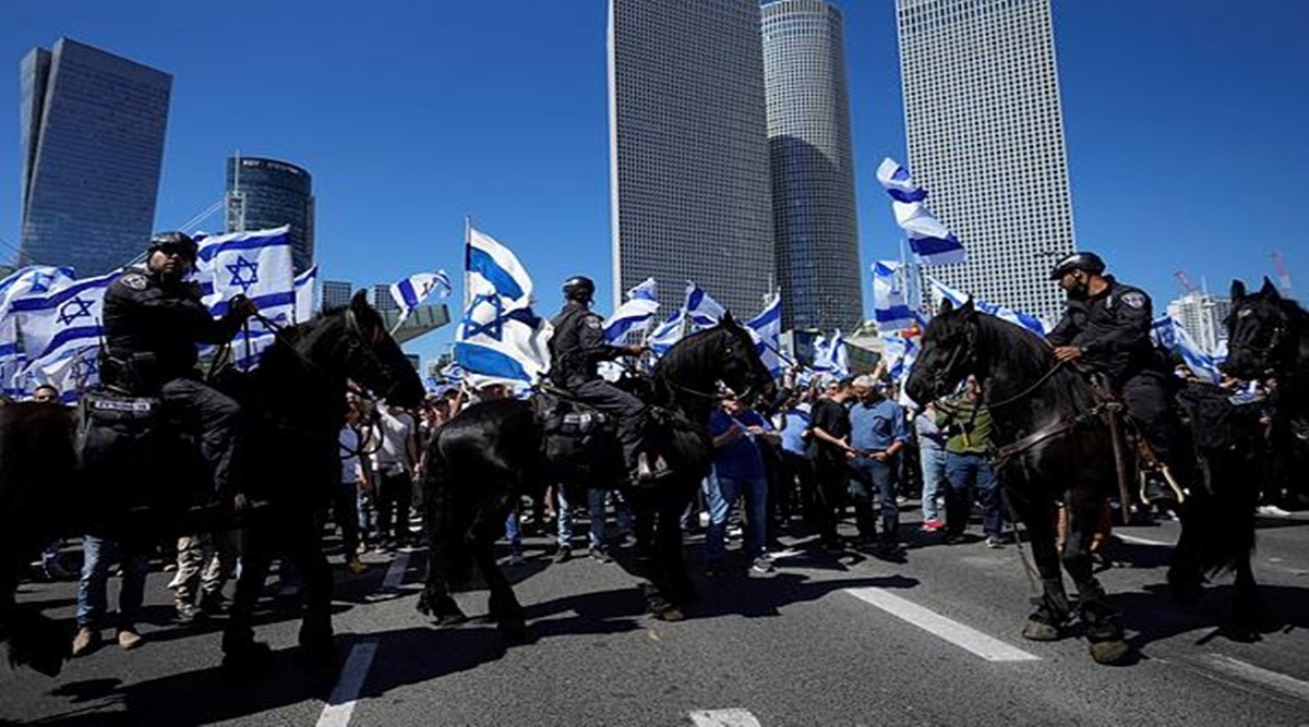 Mounted police are deployed as Israelis block a main road to protest against plans by Prime Minister Benjamin Netanyahu's new government to overhaul the judicial system, in Tel Aviv, Israel, Thursday, March 9. (AP Photo/Ohad Zwigenberg)
