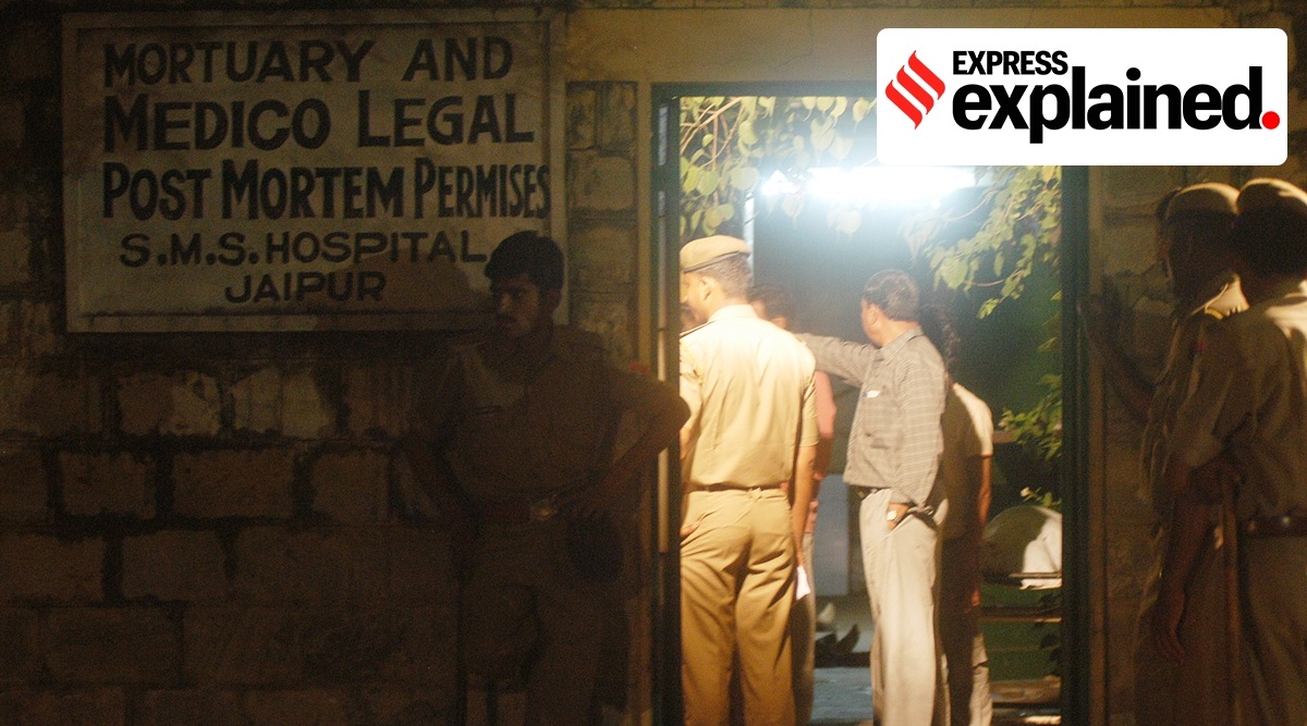 Policemen outside the SMS Hospital mortuary after the blasts