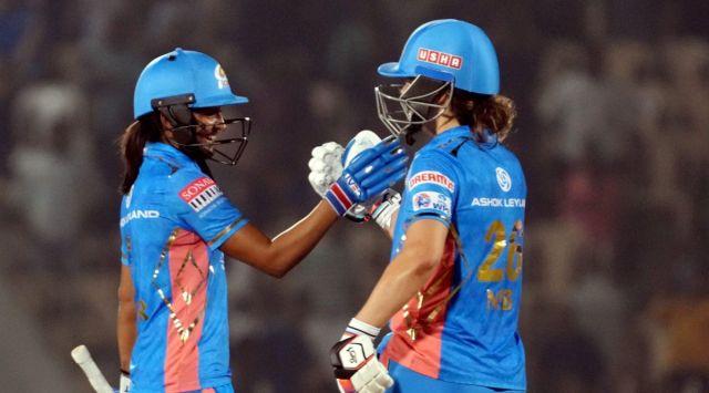 Mumbai Indians player Nat Sciver-Brunt and Harmanpreet Kaur celebrate thier victory against the UP Warriorz during Women's Premier League (WPL) cricket match in Mumbai, Sunday, March 12, 2023. (PTI Photo)