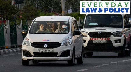 Manish Sisodia in a car with govt officials.