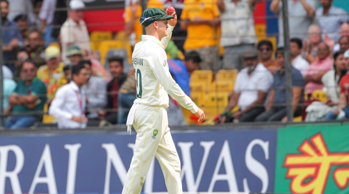 Australia's Matthew Kuhnemann, holds the ball as he acknowledges the crowd after taking a haul of five wickets on day one of their third cricket test match against India in Indore, India, Wednesday, March 1, 2023. (AP Photo/Surjeet Yadav)