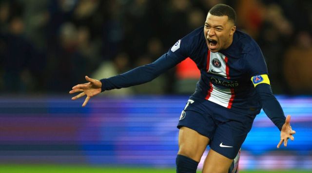 PSG's Kylian Mbappe celebrates after scoring his side's fourth goal during the French League One soccer match between Paris Saint-Germain and Nantes at the Parc des Princes in Paris, Saturday, March 4, 2023. (AP Photo/Aurelien Morissard)