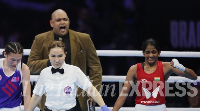 Referee stands with India’s Nitu Ghanghas (red) and Mongolia’s Lutsaikhan Altansetseg to declare Nitu as a winner during the final match in 48 kg category at the 2023 IBA Women’s Boxing World Championships, in New Delhi (Express Photo by Tashi Tobgyal)
