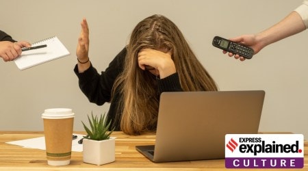 An overworked woman in office.