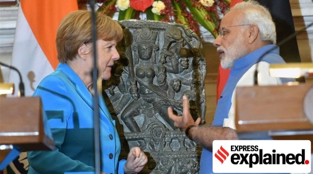 PM Modi and then German Chancellor Angela Merkel with a 10th-century Durga idol returned by Germany, in New Delhi in 2015. (PTI)