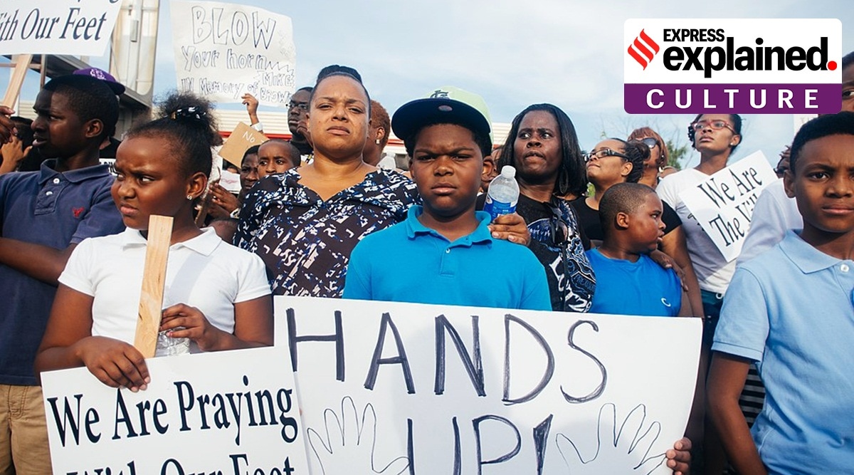 What Does Woke Mean   Protesters With Signs In Ferguson 