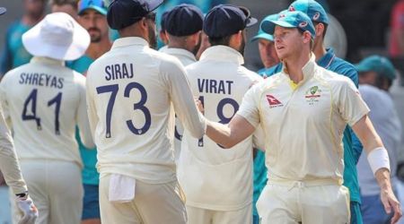 Australia's captain Steve Smith, right, shake hands with India's Mohammed Siraj, second left, after Australia won the third cricket test match against India in Indore, India, Friday, March 3, 2023. (AP Photo/Surjeet Yadav)
