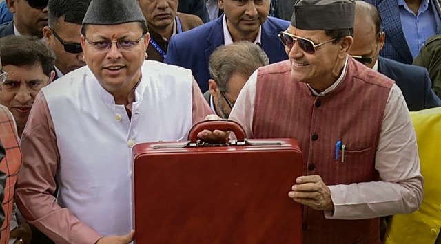 Uttarakhand CM Pushkar Singh Dhami with Finance Minister Prem Chand Aggarwal at the Assembly. (PTI)