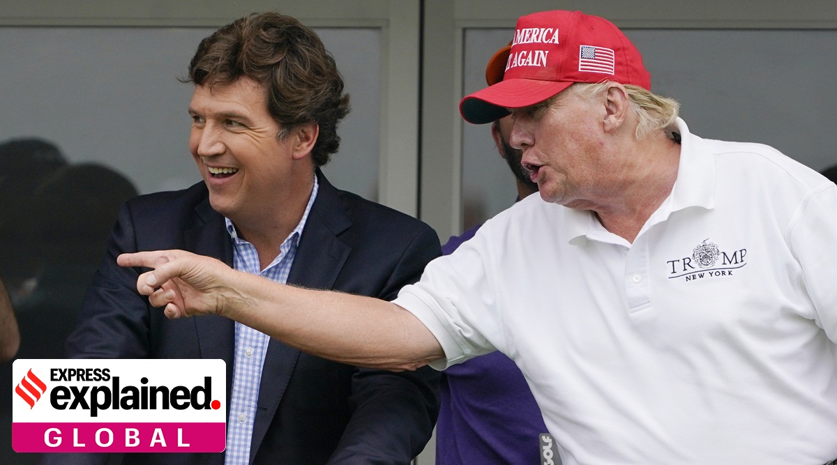 Tucker Carlson, left, and former President Donald Trump, talk while watching golfers on the 16th tee during the final round of the LIV Golf Invitational at Trump National in 2022.