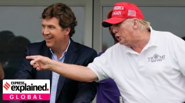 Tucker Carlson, left, and former President Donald Trump, talk while watching golfers on the 16th tee during the final round of the LIV Golf Invitational at Trump National in 2022.