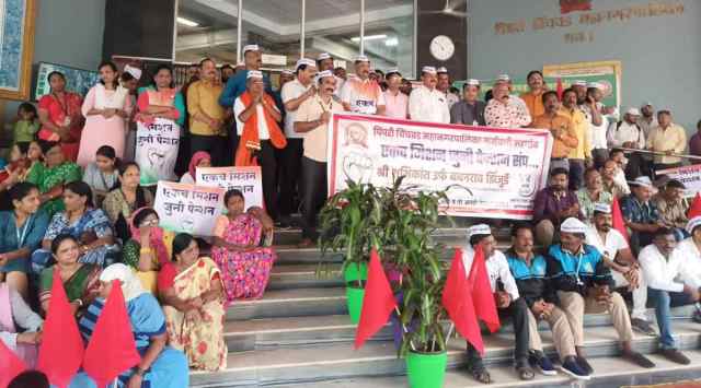 Employees protest at PCMC headquarters. 